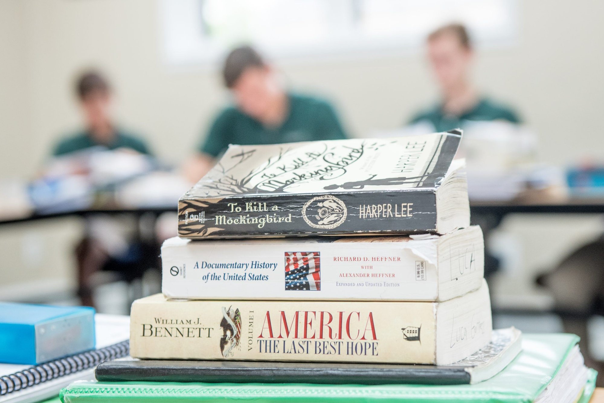 stacked books with student background