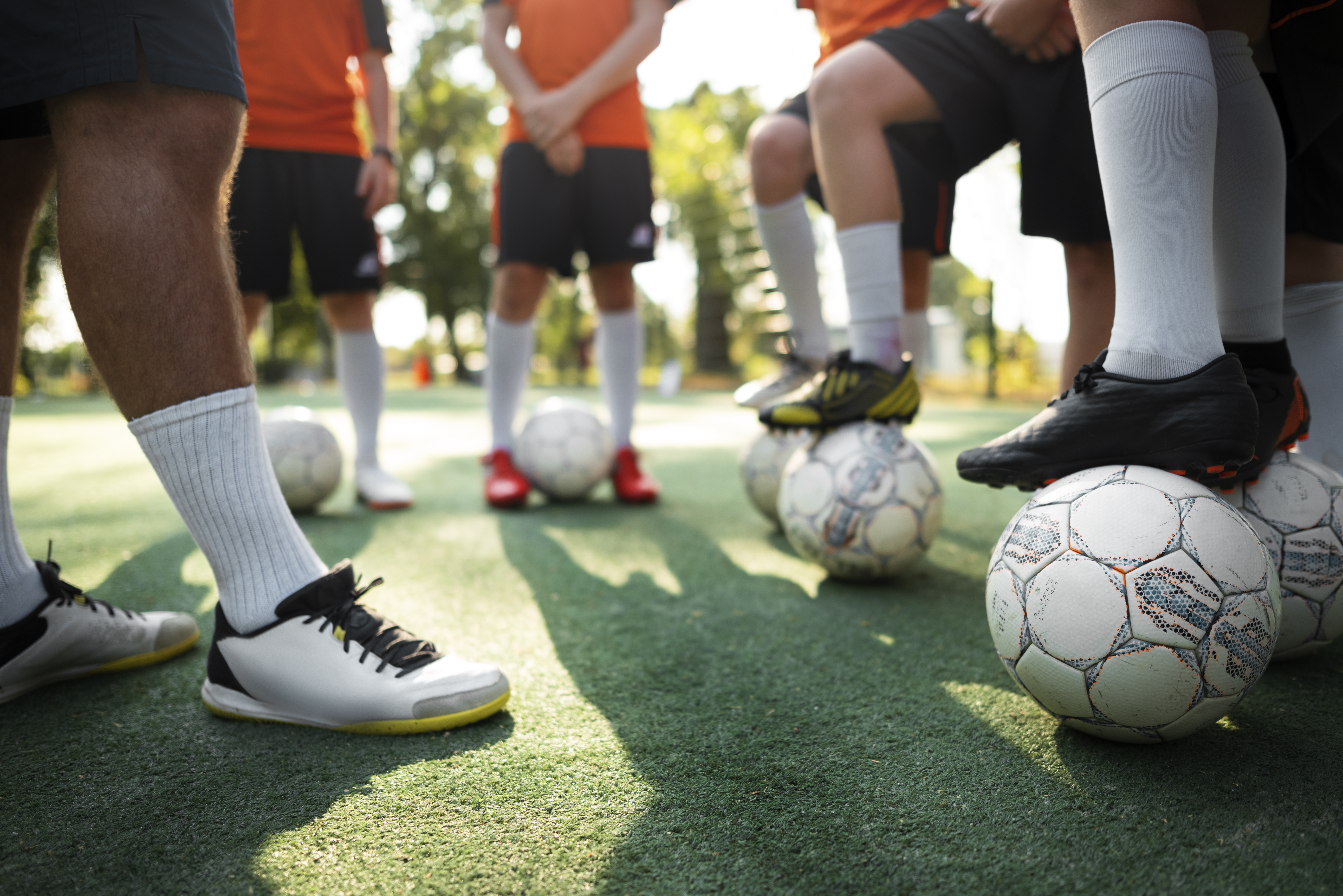football-trainer-teaching-his-pupils